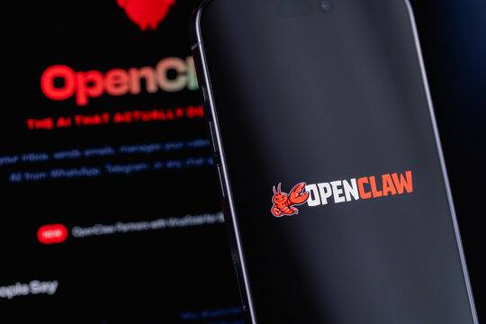 OpenClaw logo on a screen smartphone iPhone and display notebook closeup. OpenClaw is an open-source autonomous AI agent. Batumi, Georgia - March 19, 2026