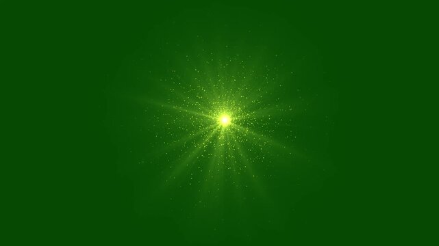 Abstract golden glitter sun lens explosion, slow motion sun light flare, golden dust glitter shining stars, lens flare glitter on green background sparks magic dust, light rays shining stars.