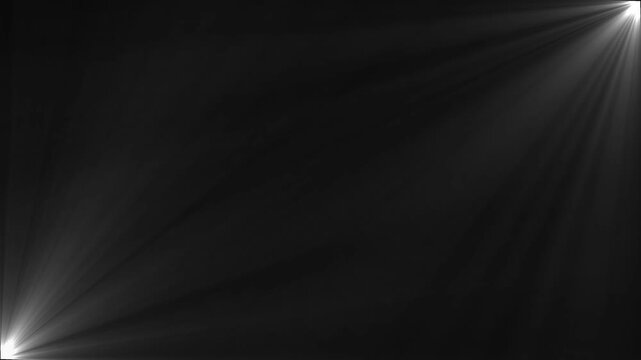 Stage light beam shining on black background for overlay effect.