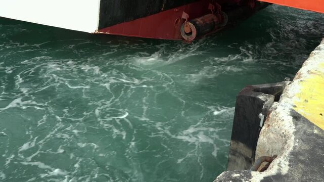 Ship's propeller water swirling from back side 