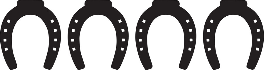 Fototapeta premium Four black horseshoes with white nails