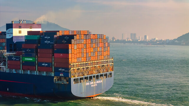 Aerial top down view of a large container cargo ship in motion over open ocean Ba Ria Vung Tau, Ho Chi Minh city, Vietnam