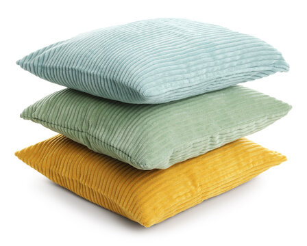 Soft stacked colorful cushions isolated on white