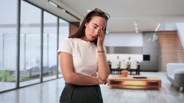 Young Woman Rubbing Her Eye At Work, Feeling Sore