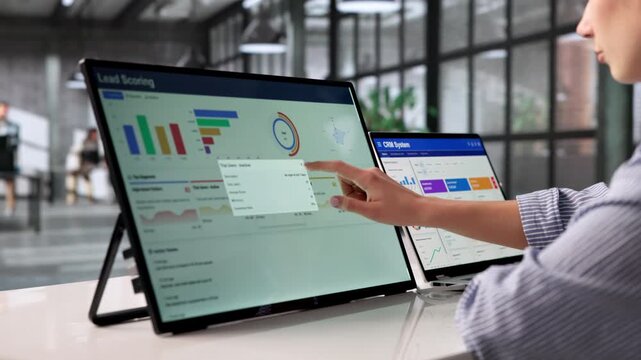 Marketing Manager Reviews Lead Scoring Dashboard
