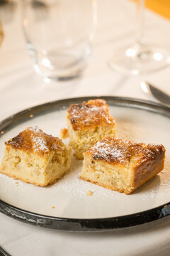 Traditional Pastiera Napoletana cake served on a rustic restaurant table