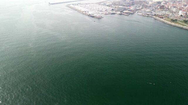 Istanbul Atakoy Marina and Bakirkoy ferry terminal reveal from the sea shot