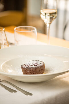Elegant presentation of a classic Italian dessert served in a fine dining setting. The image captures the rich textures, delicate plating, and appetizing details of an artisanal sweet treat