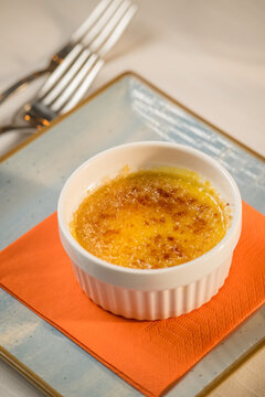 Elegant presentation of a classic Italian dessert served in a fine dining setting. The image captures the rich textures, delicate plating, and appetizing details of an artisanal sweet treat