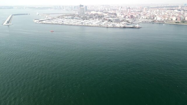 Atakoy Marina and Bakirkoy ferry with Istanbul city in the background reveal