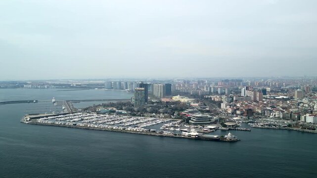 Atakoy Marina and Bakirkoy ferry with Istanbul city in the background fly left
