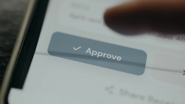 User taps the digital button labeled Approve with a checkmark icon