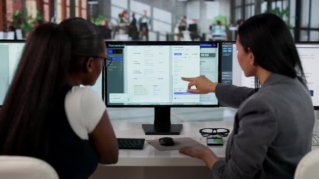 Manager Coaching Young Women Using Document Management System Software