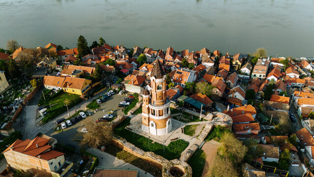 Aerial view of Gardos Tower surrounded by historic orange-roofed houses and the Danube river in Beograd, Grad Beograd, Serbia.