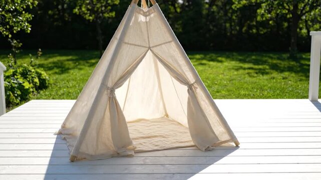 Unbleached cotton teepee play tent outdoor garden white wooden deck natural sunlight cozy inviting space for children activities relaxation backyard summer minimalist shade open entrance peaceful