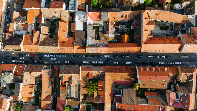 Aerial view of the historic Zemun district featuring orange-tiled rooftops and a street lined with parked cars in Belgrade, City of Belgrade, Serbia.