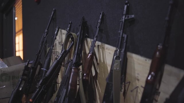 Racks of AK-74 Rifles in Repurposed Military Staging Area