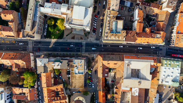 Aerial view of the historic Zemun district featuring urban streets with traffic, traditional red-roofed buildings, and a small green courtyard in Belgrade, City of Belgrade, Serbia.