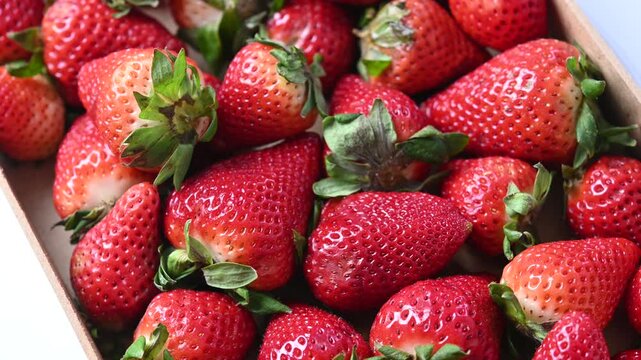 Rotating strawberries background rotating