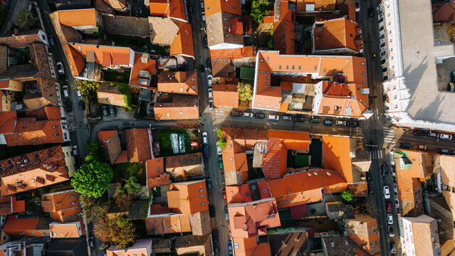 Aerial view of Zemun district featuring historic orange-tiled rooftops, narrow streets, and parked cars in Belgrade, City of Belgrade, Serbia.