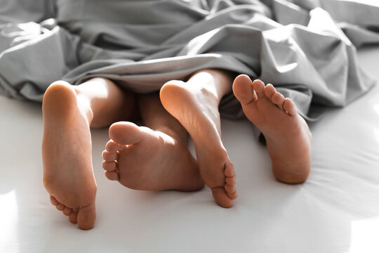 Lovely couple having sex in bed, closeup