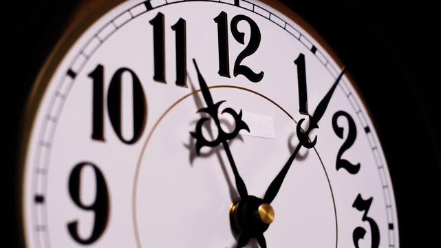 A close-up time-lapse captures black hands spinning rapidly on a white analog clock face. Concept of deadline pressure, fleeting moments, and the rapid acceleration of time passing.