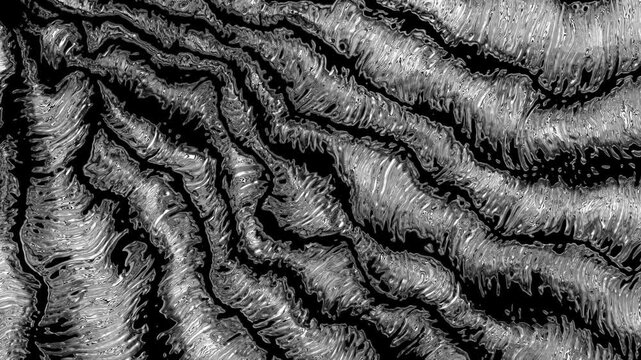 Abstract black and white waving liquid metal background