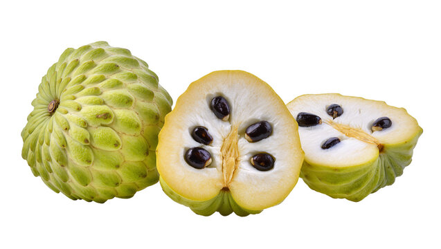 Green spiky Annona fruit whole and halved with dark seeds