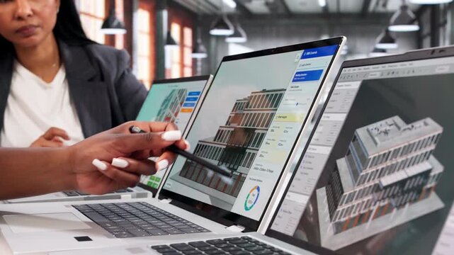 Engineers Collaborate On Laptop Designing Sustainable HVAC System