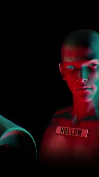 A dark looping background of endless rows of hollow mannequin style humanoid clones.