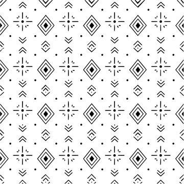 Abstract seamless black and white geometric pattern with tribal elements and diamond shapes repeating texture.
