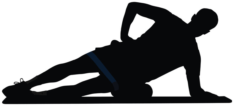 Performing thigh self-massage with an exercise ball on a mat for fitness recovery.