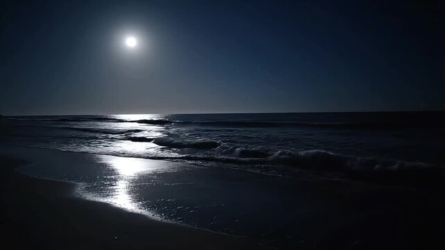 Serene ocean waves gently lap the shore under a luminous full moon.