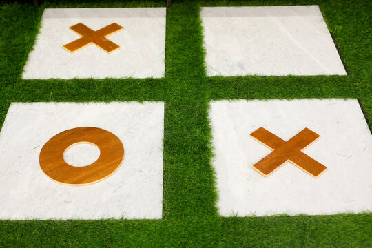 Outdoor tic tac toe game board on artificial grass