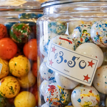 Vintage gumballs in glass jar with price tag