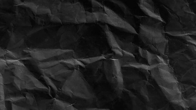 dark crumpled paper texture animated seamless loop grunge wrinkled surface with film grain abstract 4k