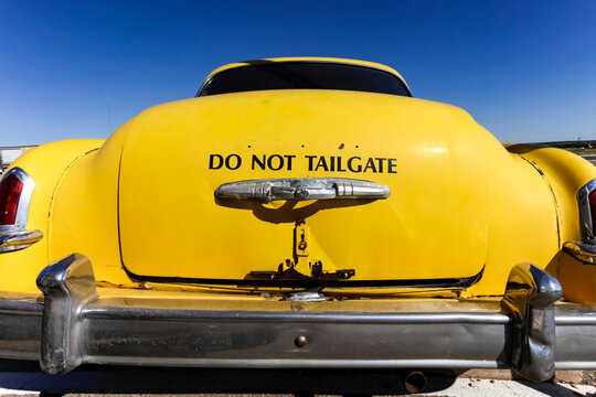 Yellow Classic Car Trunk with Do Not Tailgate Notice