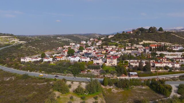 Aerial Drone Descent Over Alassa Village and Busy Highway in Limassol Cyprus