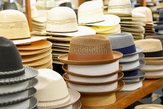 Stack of Straw Hats at Market Stall