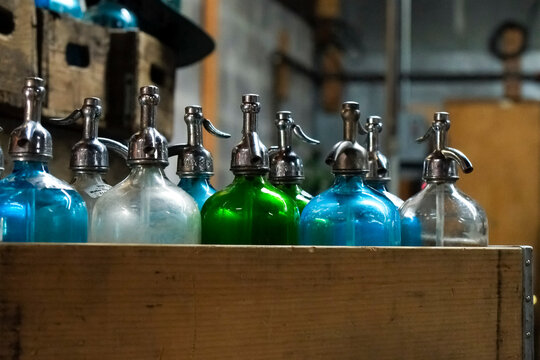 Vintage Soda Siphon Bottles on Shelf