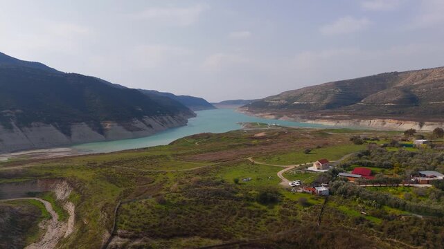 Wide Drone Flight Over Kouris Dam Reservoir and New Agia Paraskevi Church Cyprus