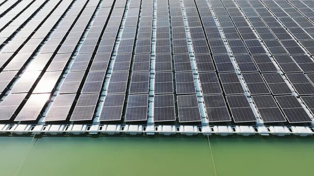 High angle view of floating PV panels and closed-house poultry farm for energy-efficient livestock production.