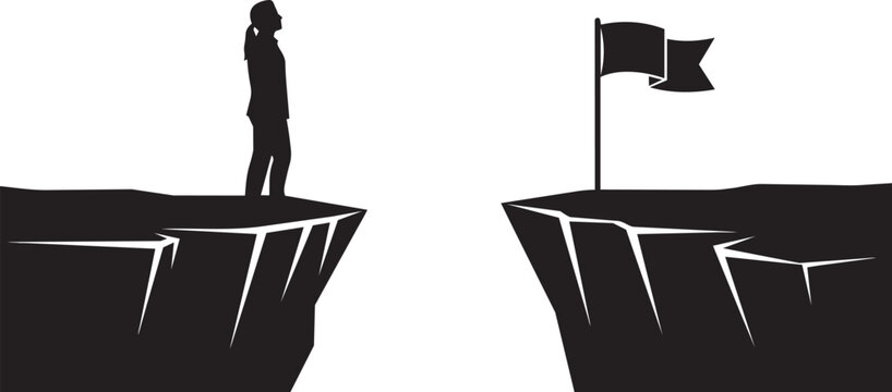 Silhouette of a businesswoman standing on a cliff edge looking at a flag on the other side of a gap