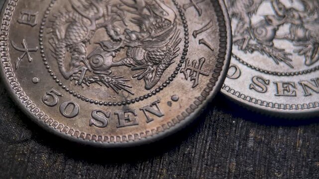 Macro Video of Obverse Meiji 50 Sen Silver Coin with Dragon Design