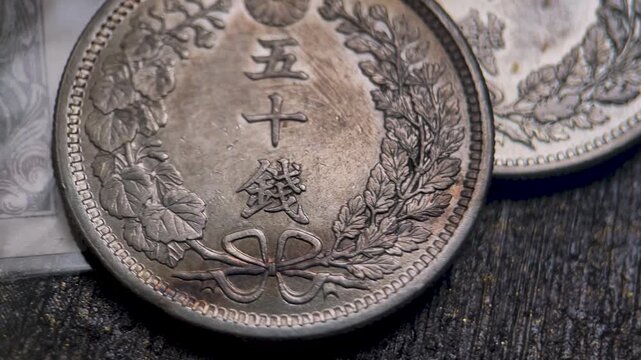 Macro Video of Reverse Side Meiji 50 Sen Silver Coin with Japanese Denomination