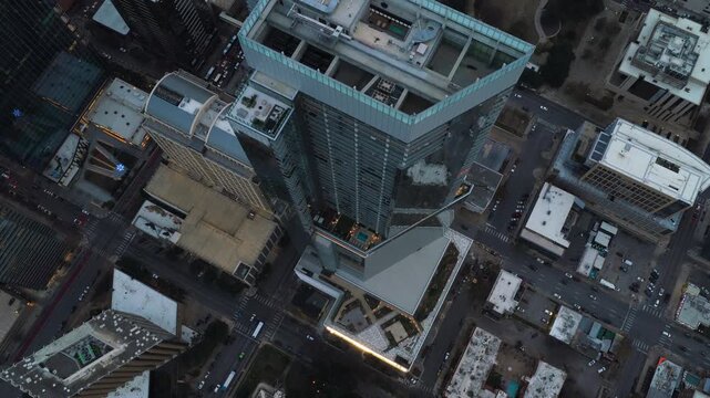 Aerial Drone Glides Over Sixth and Guadalupe Tower Downtown Austin at Dusk
