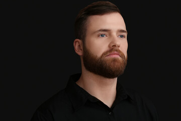 Fototapeta premium Handsome bearded man on dark background, closeup
