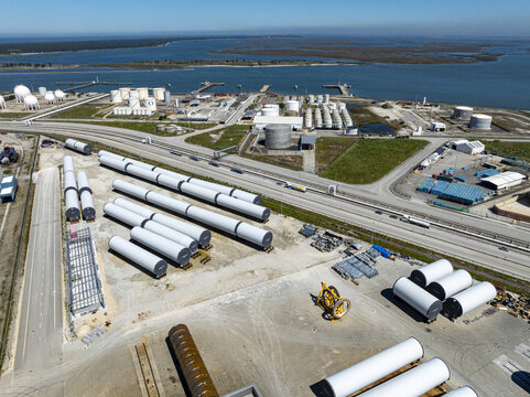 Aerial view of cylindrical industrial components contrasting against the coastal landscape near Avenida do Porto Comercial, Aveiro, Aveiro, Portugal.