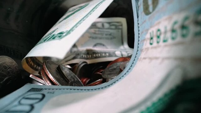 Money filmed inside of a bottle.