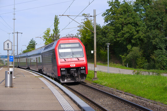 SBB CFF FFS passenger train at railway station of Swiss village of Glattfelden on a sunny late summer day. Photo taken September 7th, 2025, Zurich Glattfelden, Switzerland.